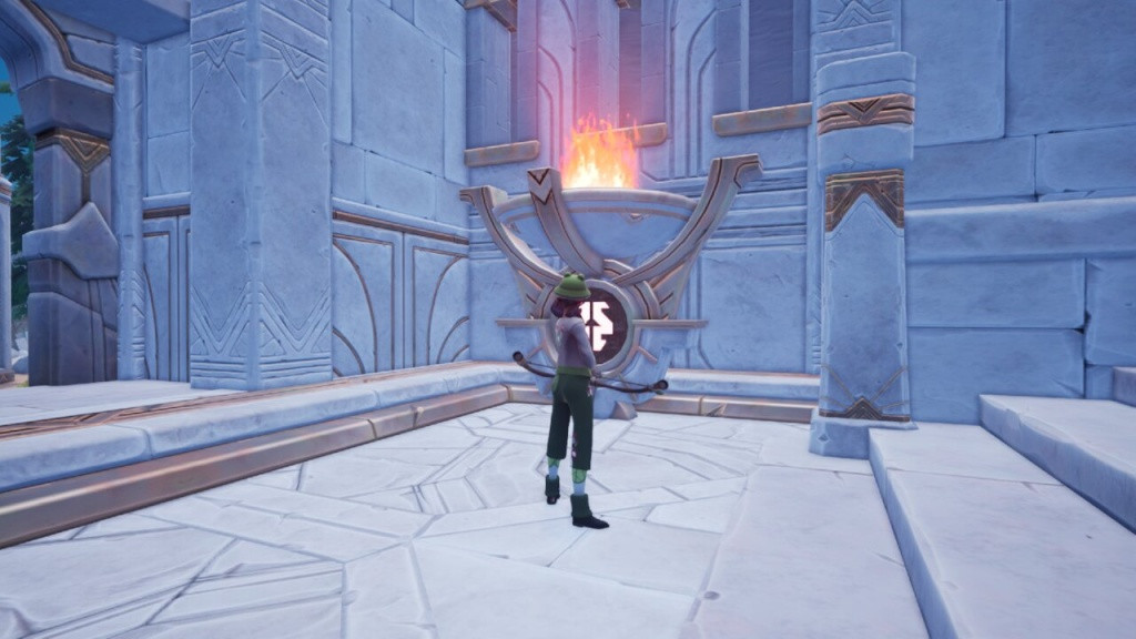 The first brazier is located bottom left of the ruin doors which players can fire an arrow at the symbol to light it. (Picture: Singularity 6 / Ashleigh Klein)