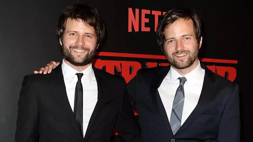 The Duffer brothers pose at an event together.